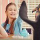 A smiling girl giving our McDonald's VFX penguin "high-five".